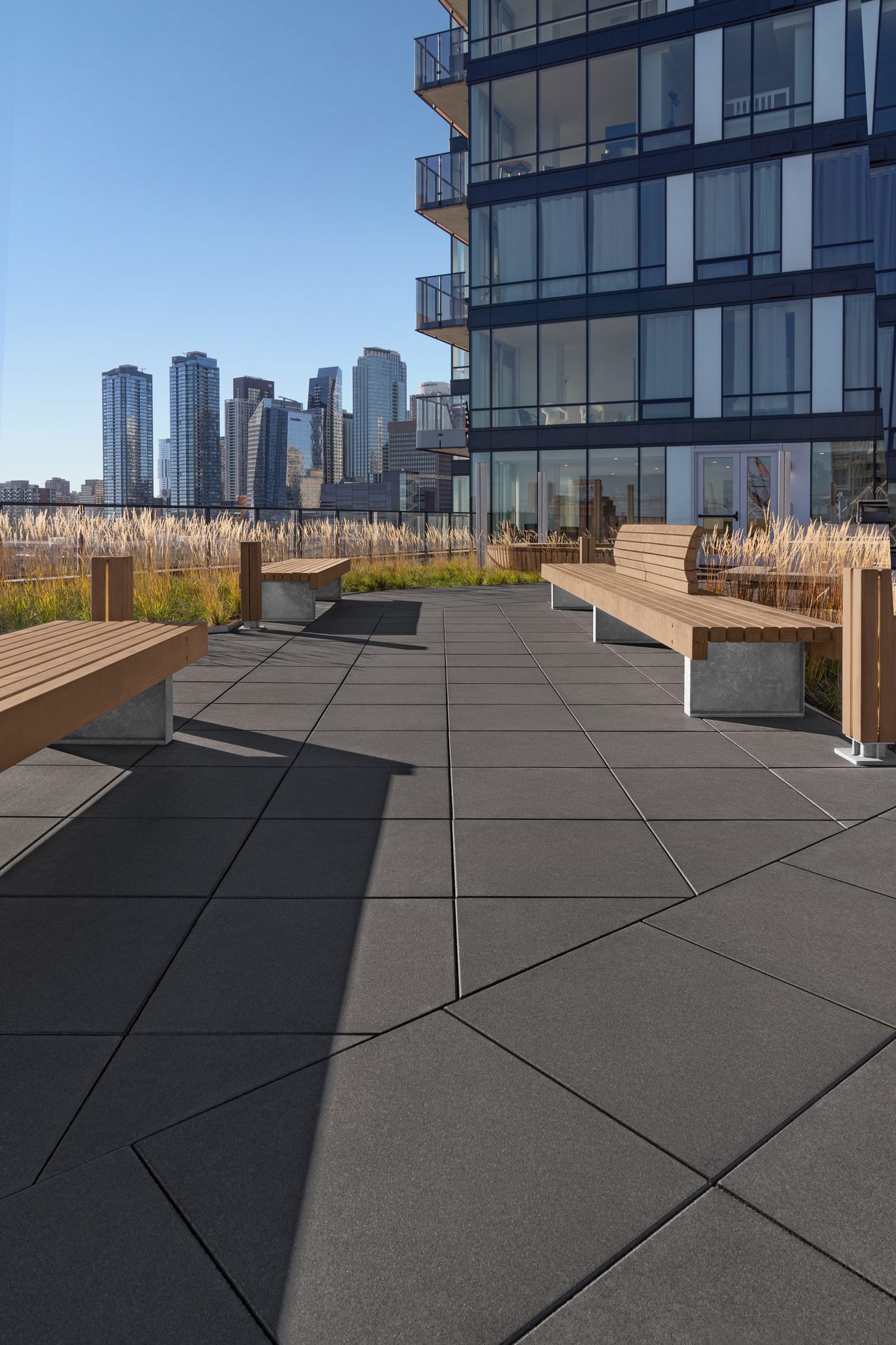 Close of shot of Techo-Bloc Industria Smooth Slabs in Onyx Black at le Duke Condos in Montreal.