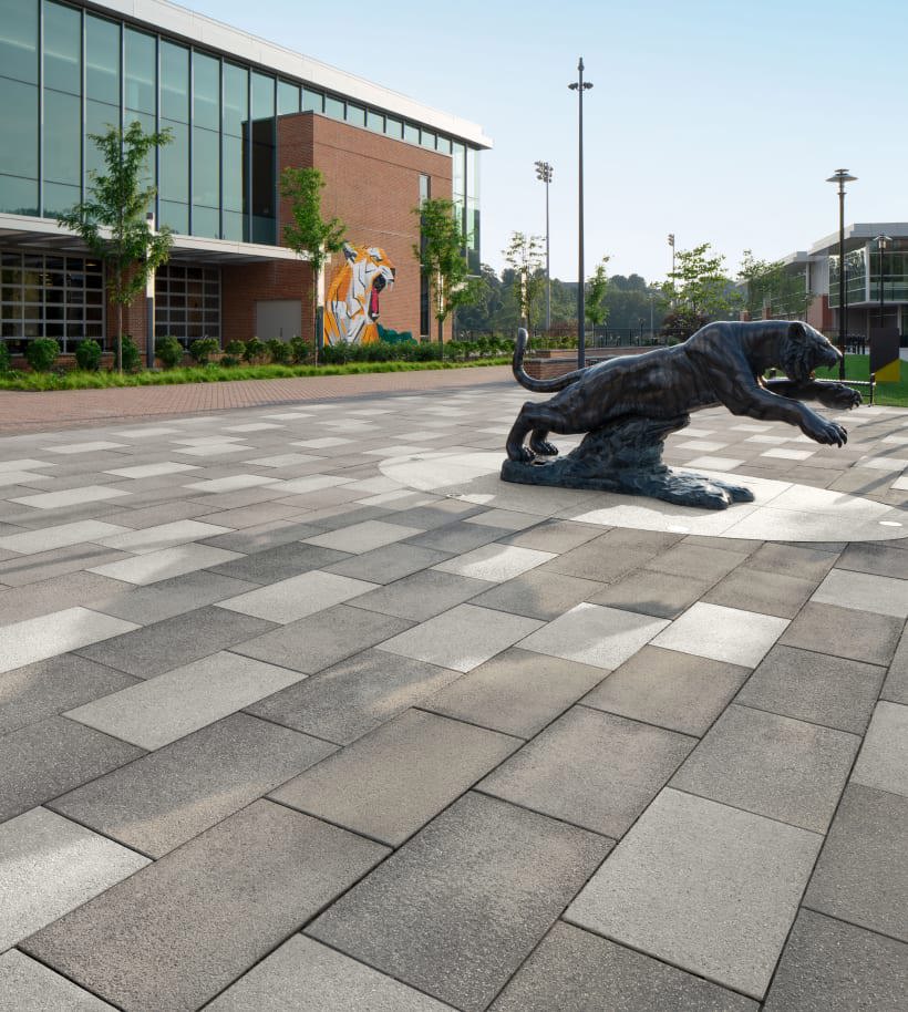 Techo-Bloc Blu Grande Pavers used in front of Towson University with building facade and statue.