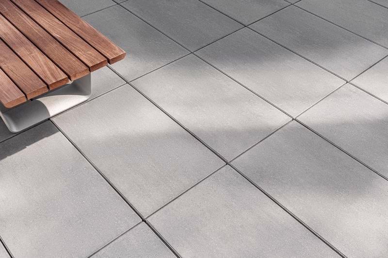 Close up view of Techo-Bloc Blu 60 Smooth Slab in Greyed Nickel installed on the Devimco Rooftop in Montreal.