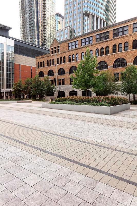 View of courtyard in front of building featuring Techo-Bloc Industria Granitex Paver.