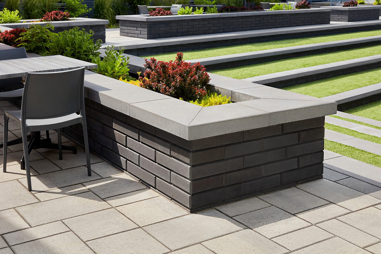 Techo-Bloc Raffinato Wall in Black Onyx and Raffinato Cap installed outside the West Island College in Montreal.